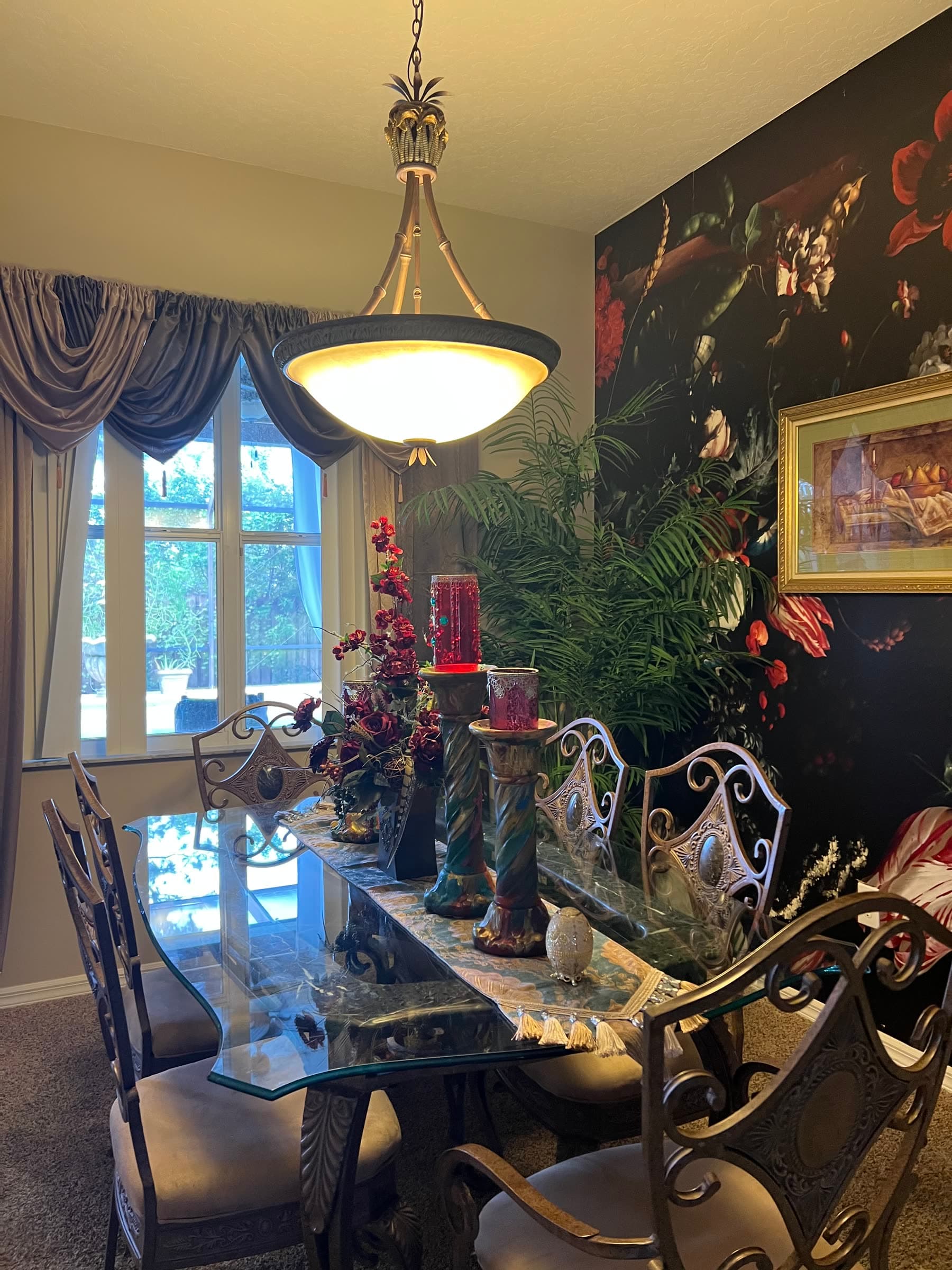 Dramatic black floral dining room inside the Palm Bay Creative Connect location.