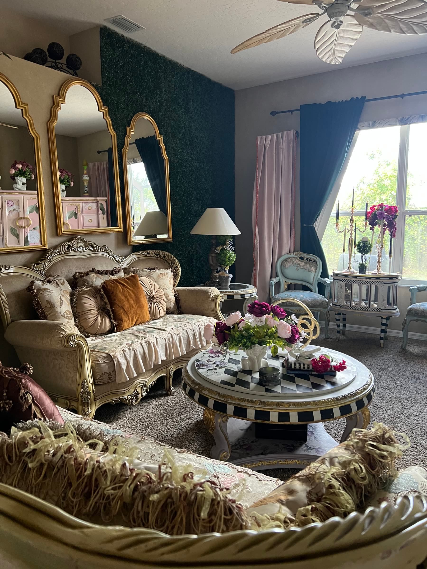 Ornate cream and gold living room inside the Palm Bay Creative Connect location.